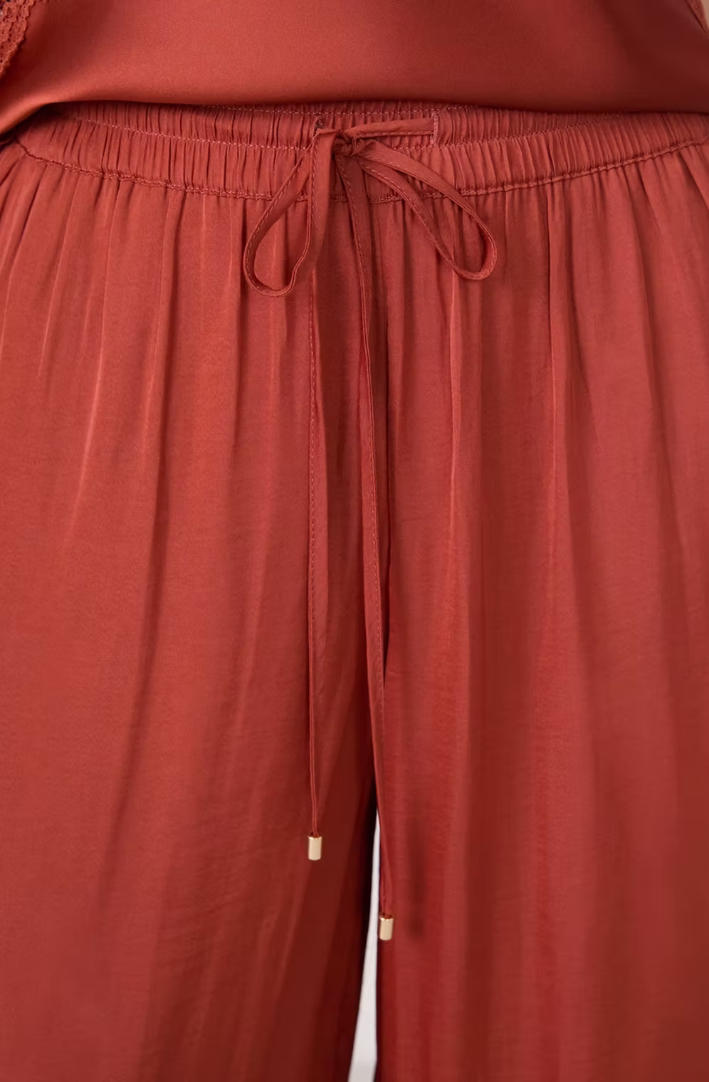 Wide-leg satin pants, Rust.